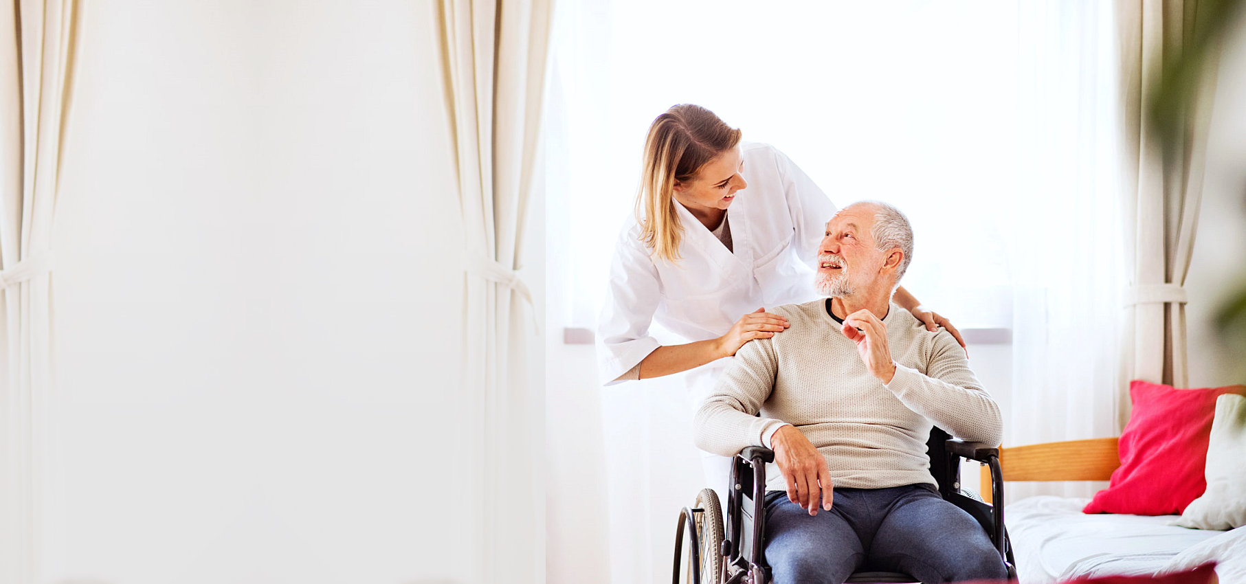 senior man on a wheelchair and a female caregiver